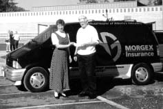 Bill Birch, with the Morgex Insurance Group Ltd., Calgary office, presents Susan Nettleton-Marinucci with a $1,000 scholarship