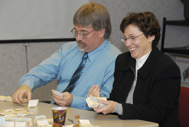 ATA district representatives Greg Jeffery, Edmonton District (left), and Sharon Armstrong, Central North, count ballots cast by members of the Alberta Teachers’ Association.