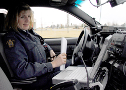 • reading and listening to issues in her patrol car