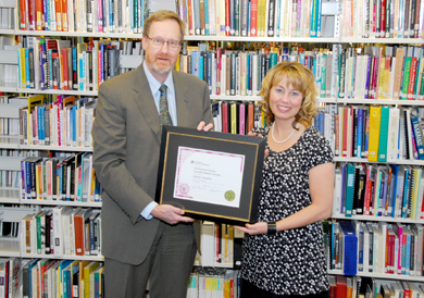 ATA Executive Secretary Gordon Thomas presents Dianna Kroetch with the Nadene M. Thomas Graduate Research Bursary. Kroetch teaches French as a second language at Daysland School. 